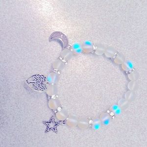 Beautiful glass beaded bracelet with star, moon and tree of life